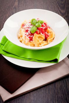 tasty fresh homemade ravioli with tomato sauce basil and parmesan