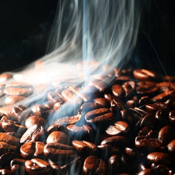 macro coffee beans in aroma smoke