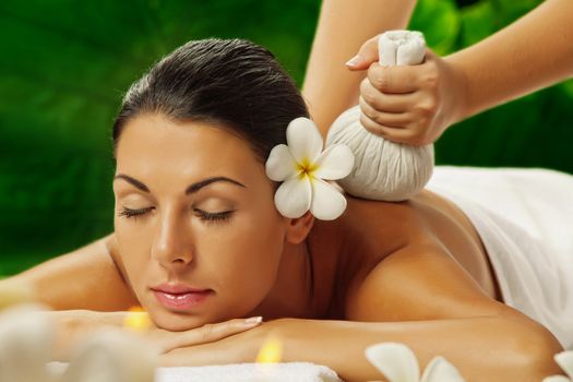 portrait of young beautiful woman in spa environment