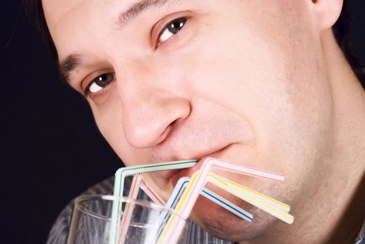 portrait of a man drinking a cocktail