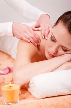 young attractive smilig woman doing wellness spa relaxing massage