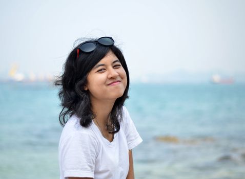 young beautiful asian girl on the seaside 