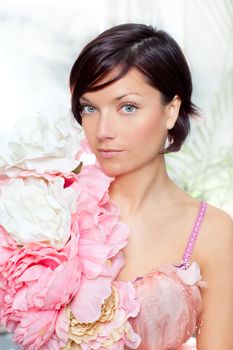 beautiful flowers woman with spring pink dress portrait