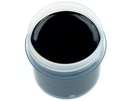 Container with Black Gouache Paint isolated on white background. Top View