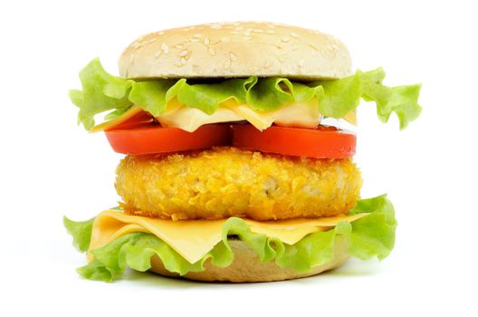 Classic Burger with Breaded Chicken, Tomatoes, Lettuce and Cheese on Sesame Bun isolated on white background