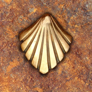 Saint James way shell golden metal on streets soil stone floor