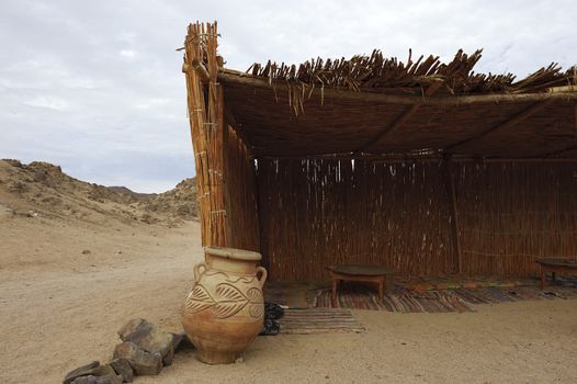 the thatch house of settlement of Bedouin tribe in Sahara desert near Hurghada