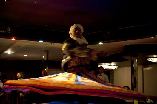 CAIRO - JAN 27: Egyptian traditional Sufi dancer performing on a yacht in River Nile.Jan 27,2013 in Cairo,Egypt.