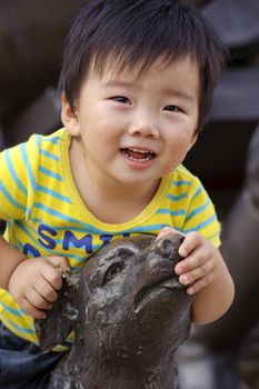 a happy baby is playing