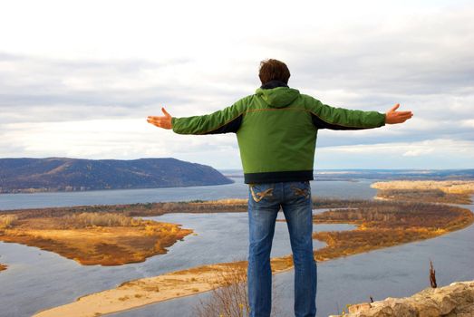 man standing on the river