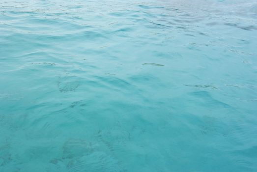 the background blue tropical sea water ripples