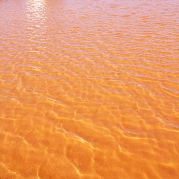 Formentera Ses Salines saltworks red orange water lakes with ripple waves