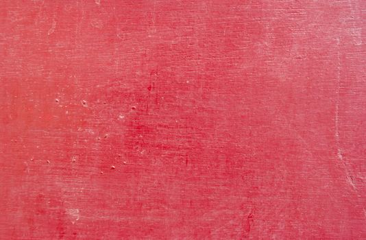 the background texture of red painted wood