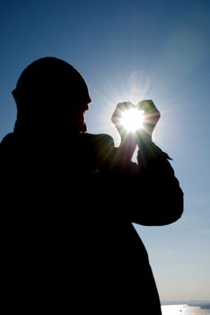 sun in the hands of men