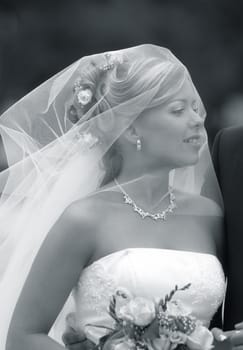 Portrait of the beautiful bride with a bouquet