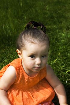 Young baby girl sitting in the park