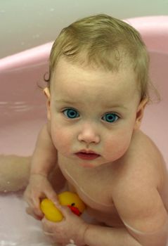 The little child taking a bath
