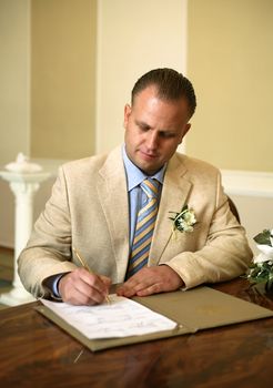 The groom signs the contract