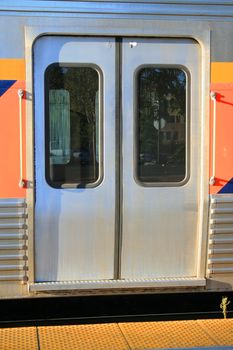 Close up of a passenger train entrance.
