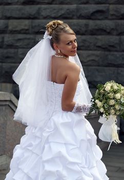 Portrait of the beautiful bride with a bouquet