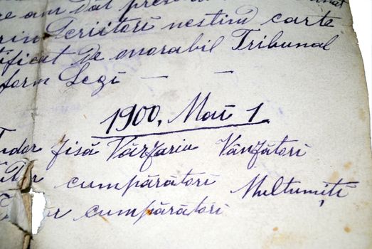 Vintage hand writing on a letter. Old paper with visible structure. Pen ink.