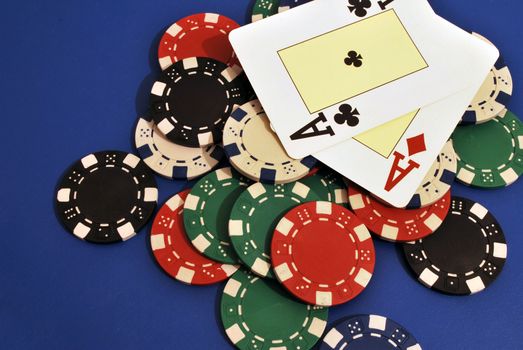 Casino chips on a blue background and ace card in Vegas