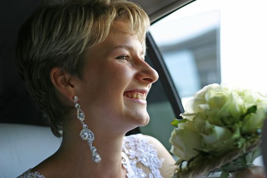 The laughing bride in the car