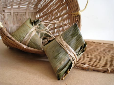 a pyramid-shaped mass of glutinous rice wrapped in leaves, one culture occasion in Chinese