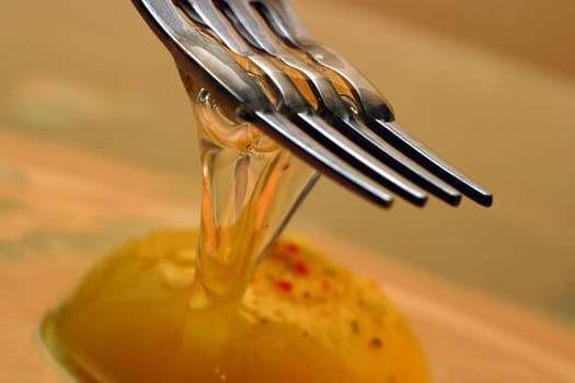 The image of a plug and broken eggs