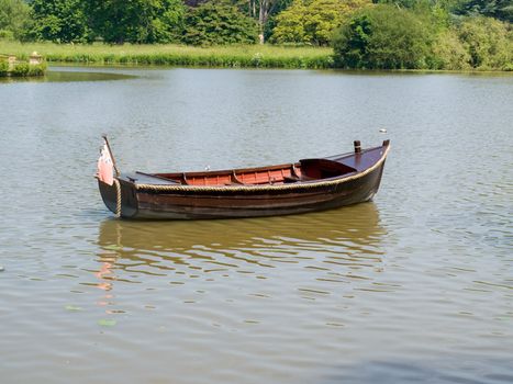 A rowing boat adrift on a lake