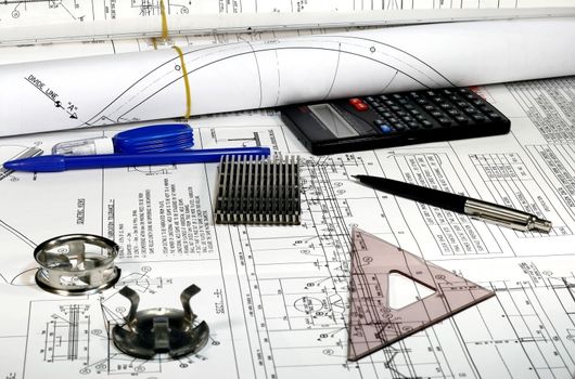 Mechanical Engineering drawings with parts pen triangle and eraser