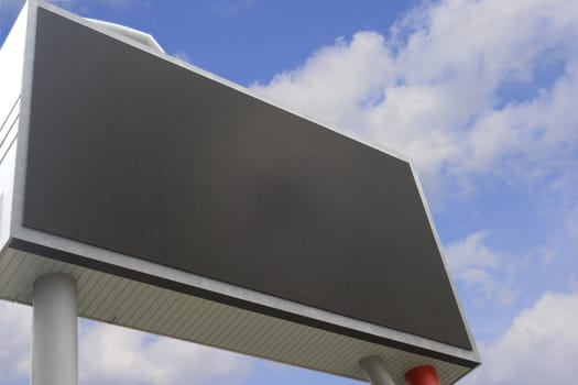 Blank Billboard with clouds concept for advertisement presentation and display