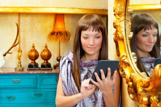 fashion woman reading ebook tablet in vintage grunge house