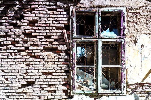 broken window, detail of a deserted house