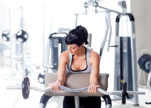 woman with weight training equipment on sport gym club