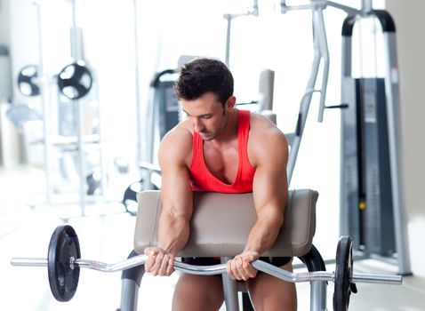 man with weight training equipment on sport gym club