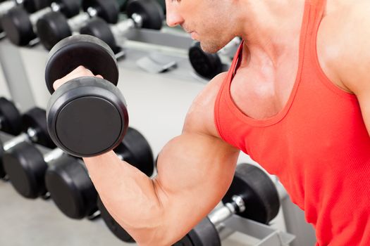 man with weight training equipment on sport gym club