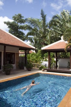 Woman swimming in pool