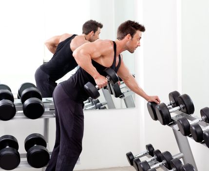 man with weight training equipment on sport gym club