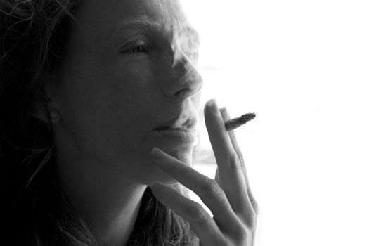 female smoker woman with cigarette beathing smoke