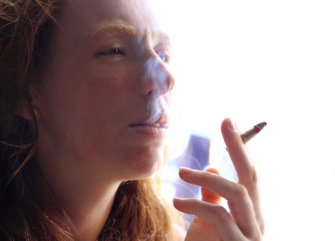 female smoker woman with cigarette beathing smoke
