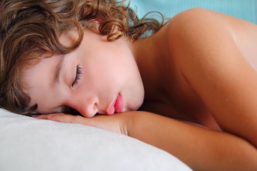 child girl sleeping happy on pillow in summer time