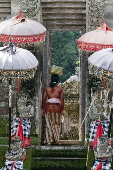 Balinese woman entering a temple