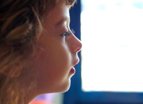 Child girl profile portrait in white window background