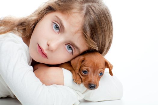 brunette kid girl with mini pinscher pet mascot dog on white background