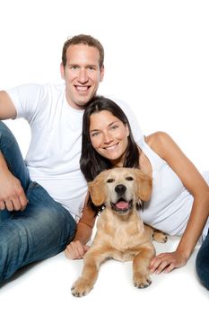 couple in love with puppy dog golden retriever isolated on white