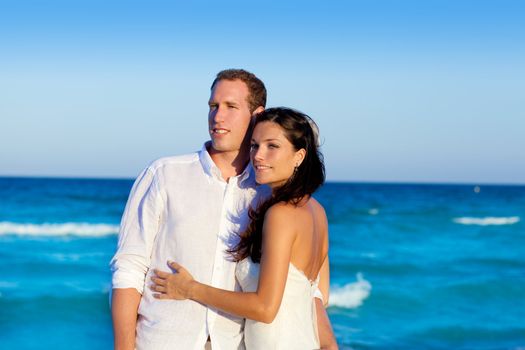 couple in love hug in blue sea vacation in Spain