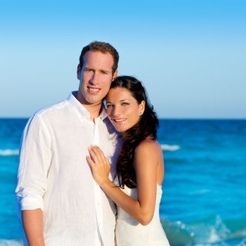 couple in love hug in blue sea vacation in Spain