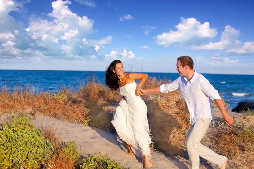 couple in love running at the beach on Mediterranean