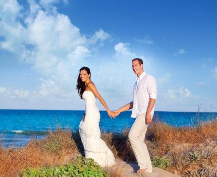 couple in love in the beach dune on Mediterranean sea